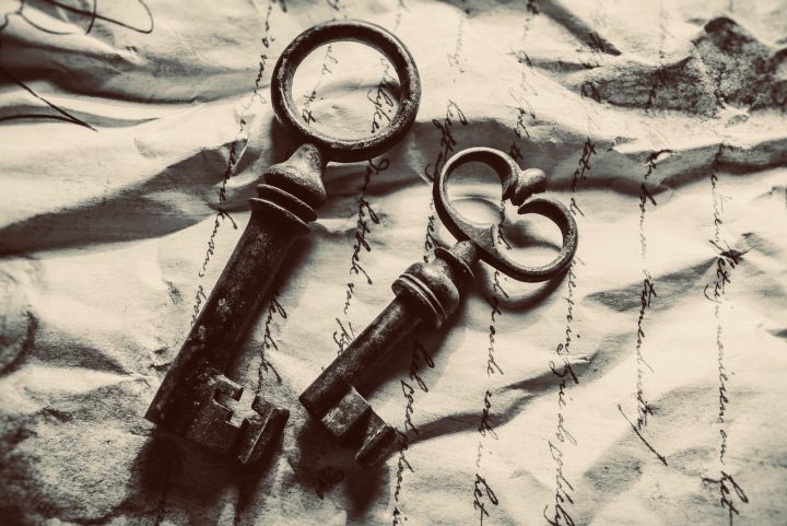 Two Black Skeleton Keys On An Old Paper